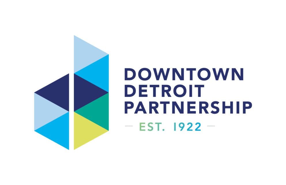 DDP logo, sketched as a capital D illustrated as multi-colored triangles. Followed by "established 1922"